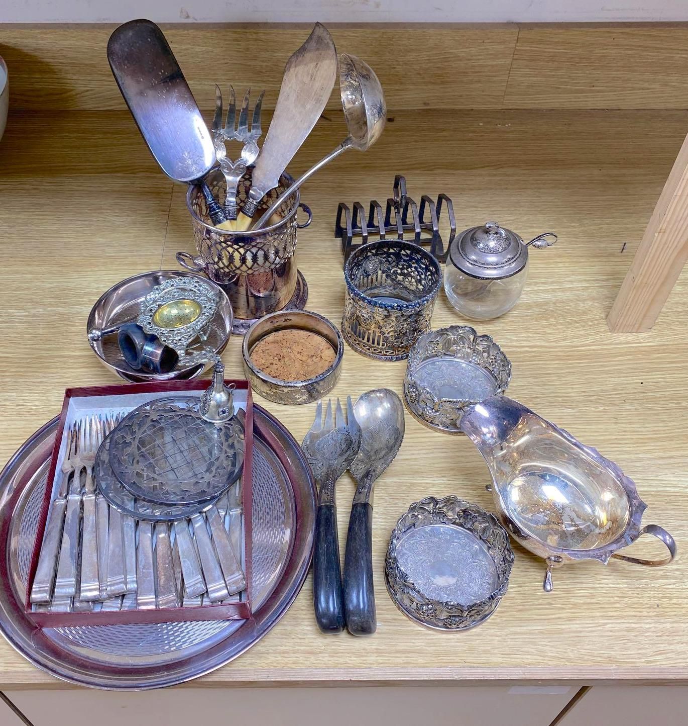 A quantity of plated items including coasters, flatware, cream jug, etc.